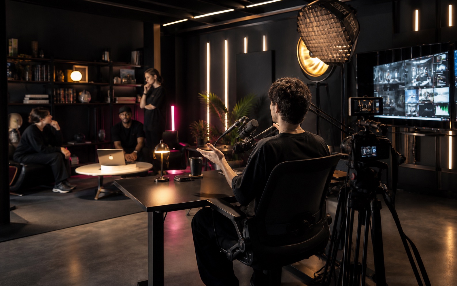 A creator recording with a production team in a professional studio